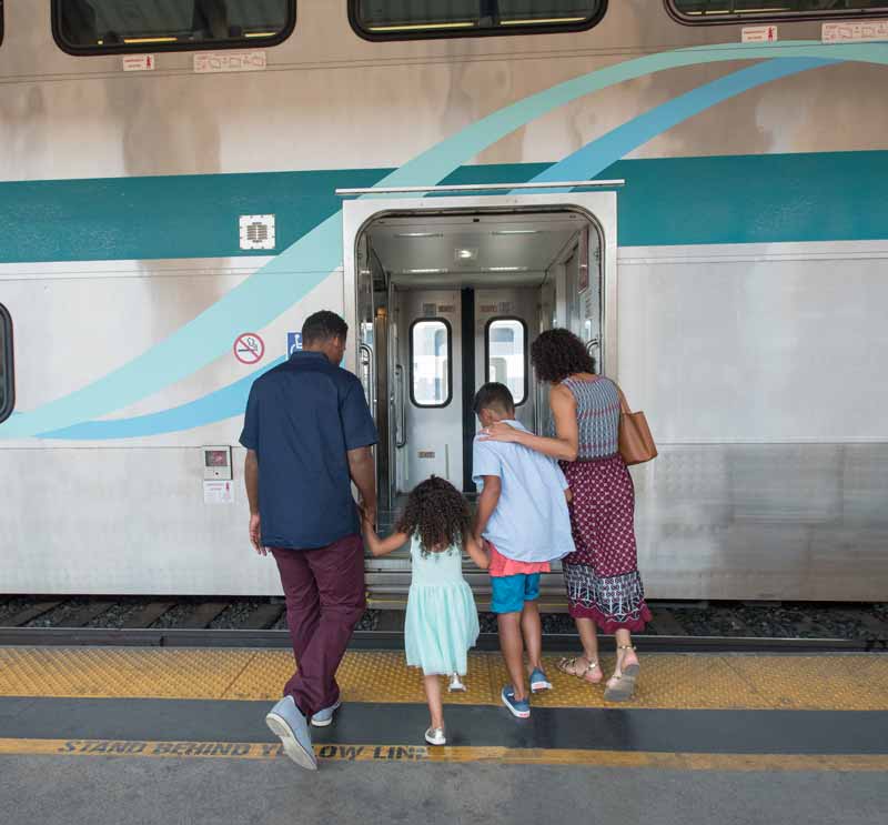 family boarding train