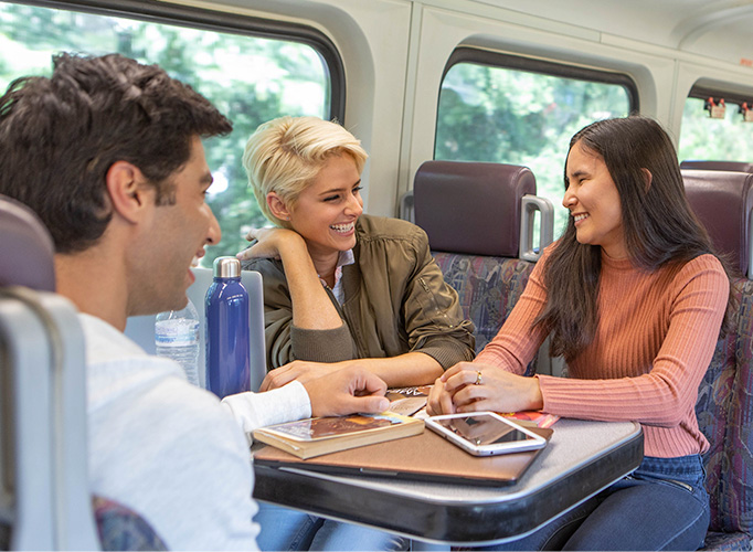 3 Metrolink riders on a train