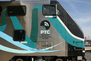 Metrolink train with a PTC logo on it